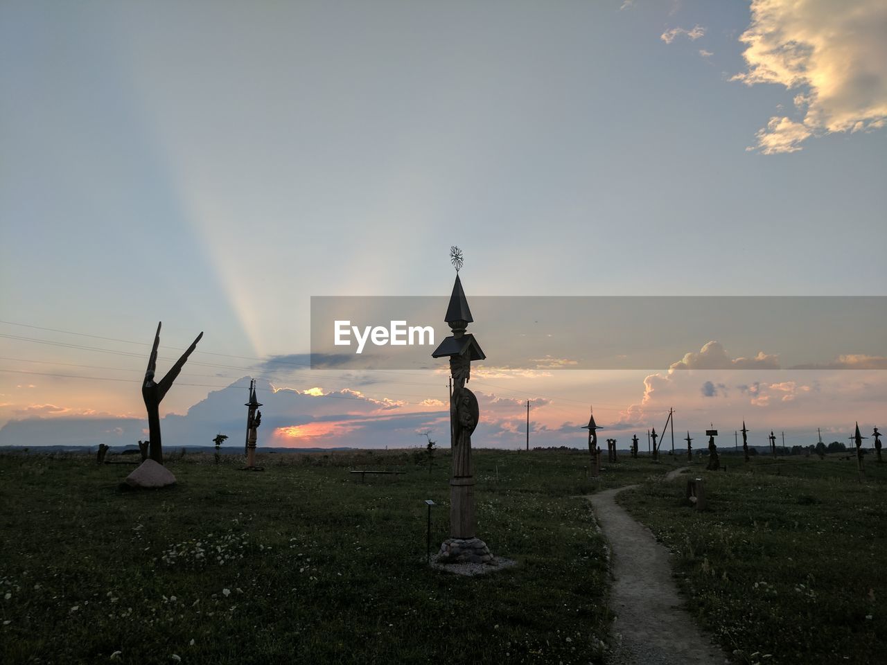 Scenic view of field against sky during sunset