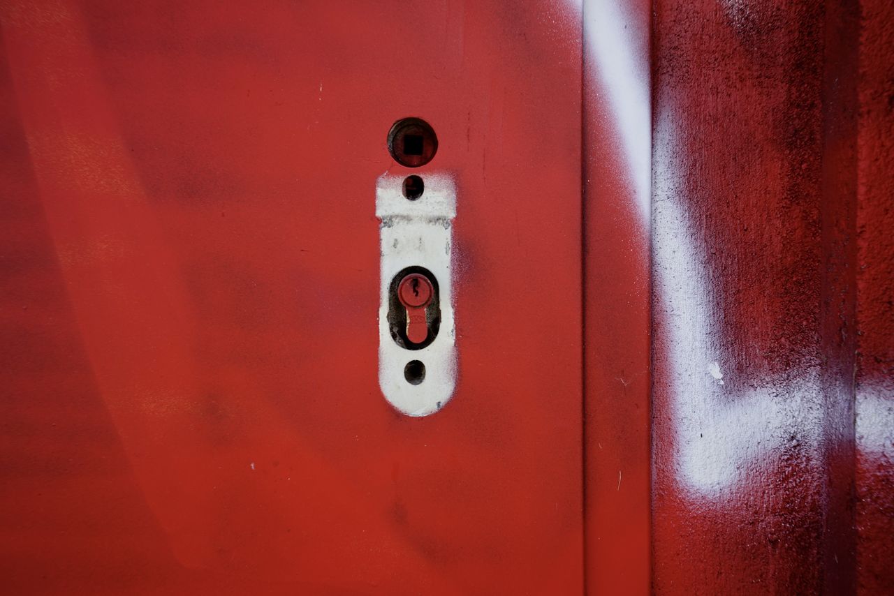 FULL FRAME SHOT OF RED DOOR WITH TEXT