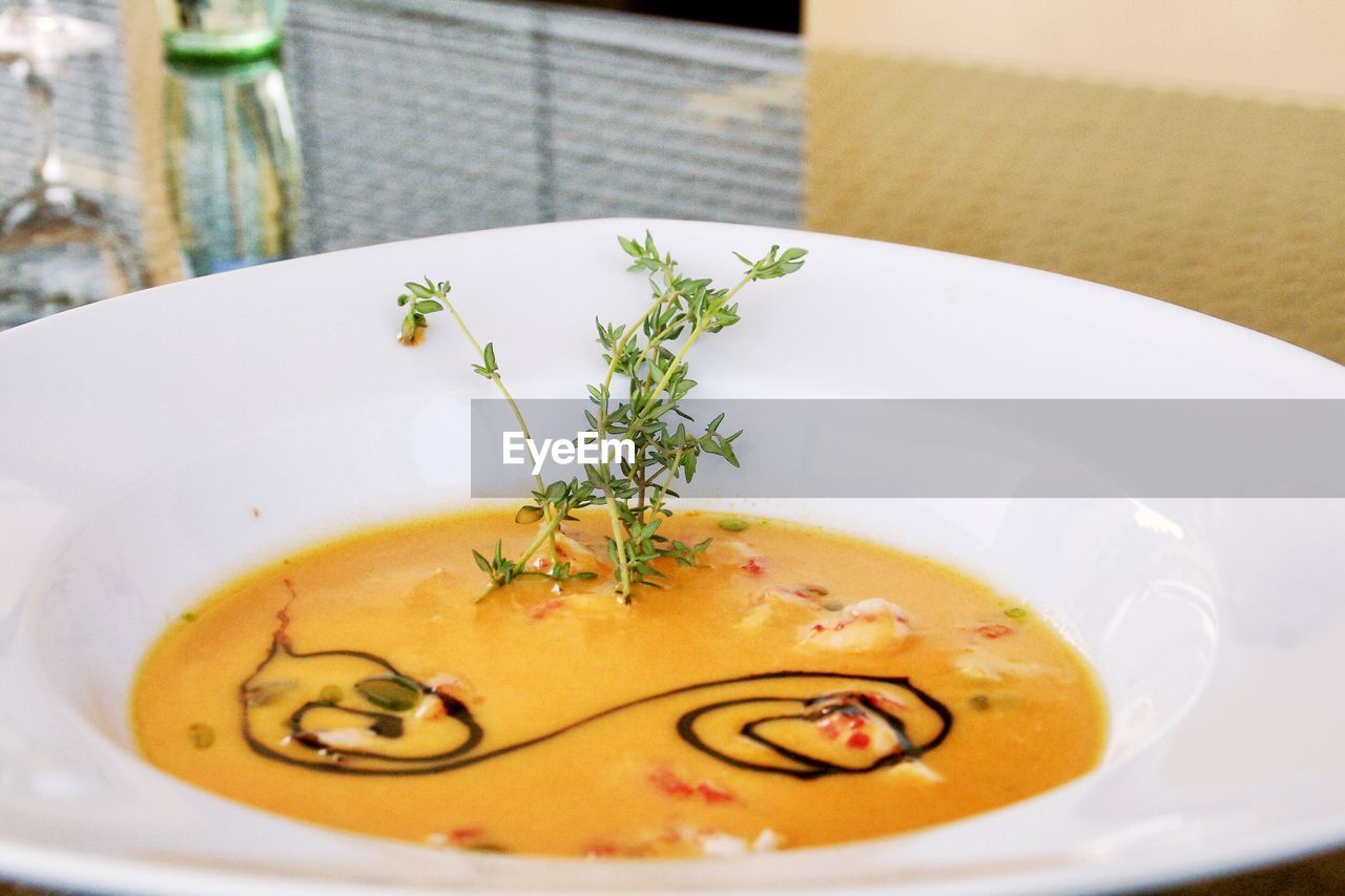 Close-up of tomato soup in bowl on table