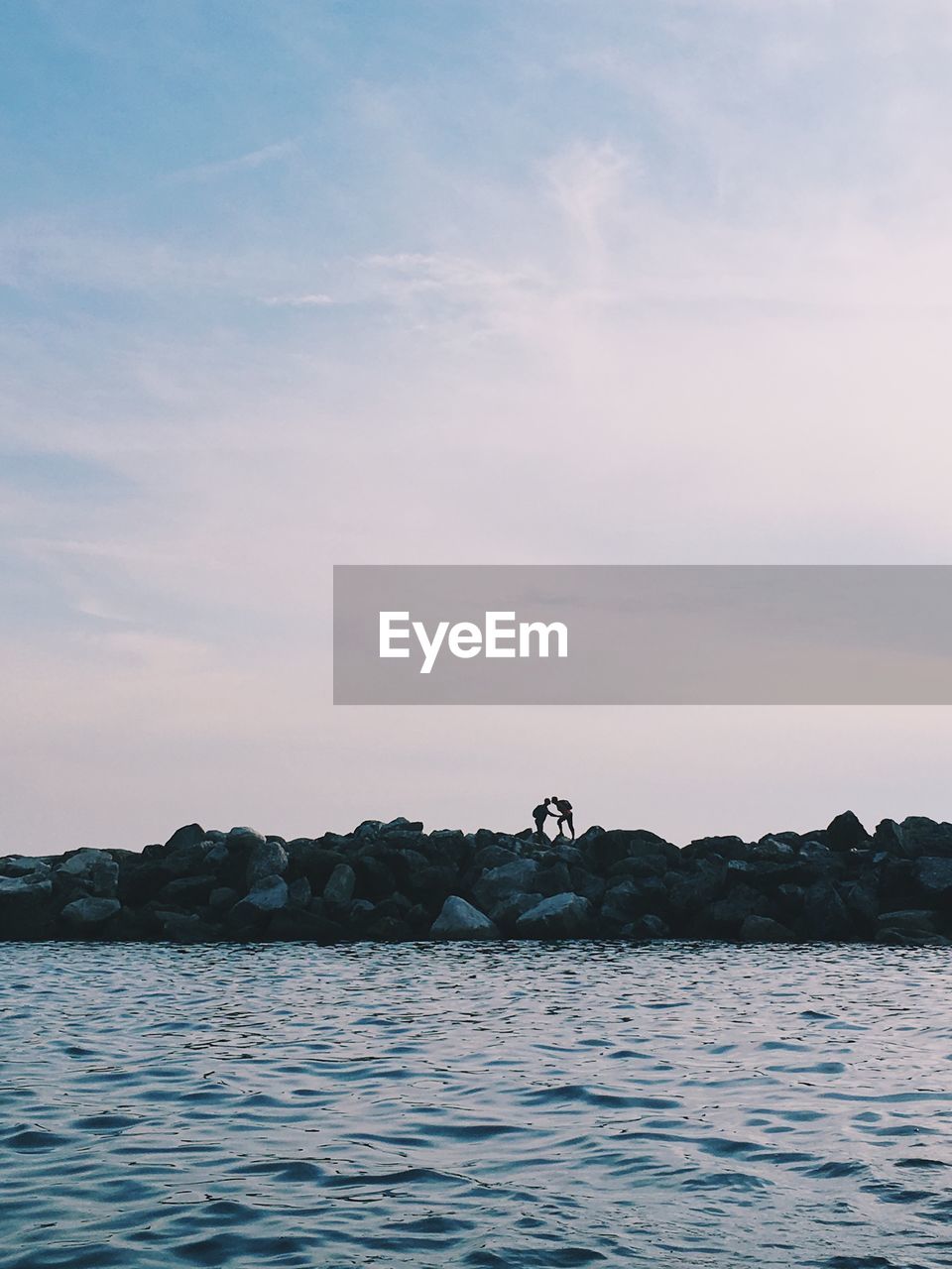 Scenic view of sea against cloudy sky