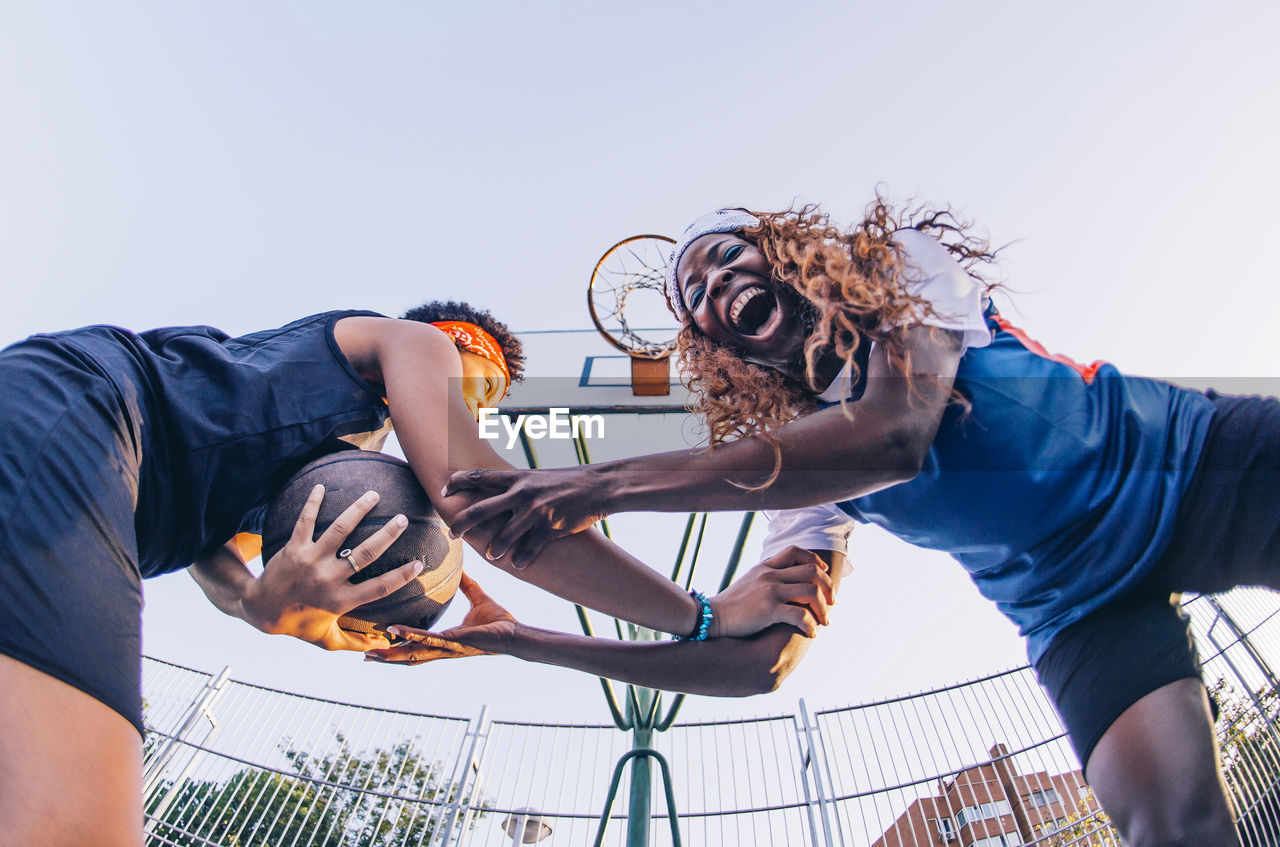 Latin and african women play basketball