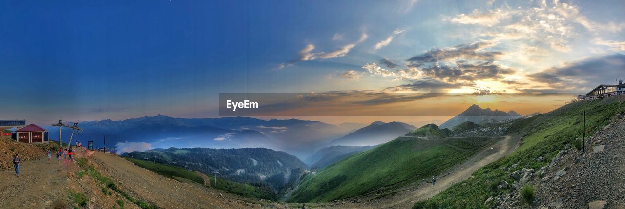 Panoramic view of landscape against cloudy sky