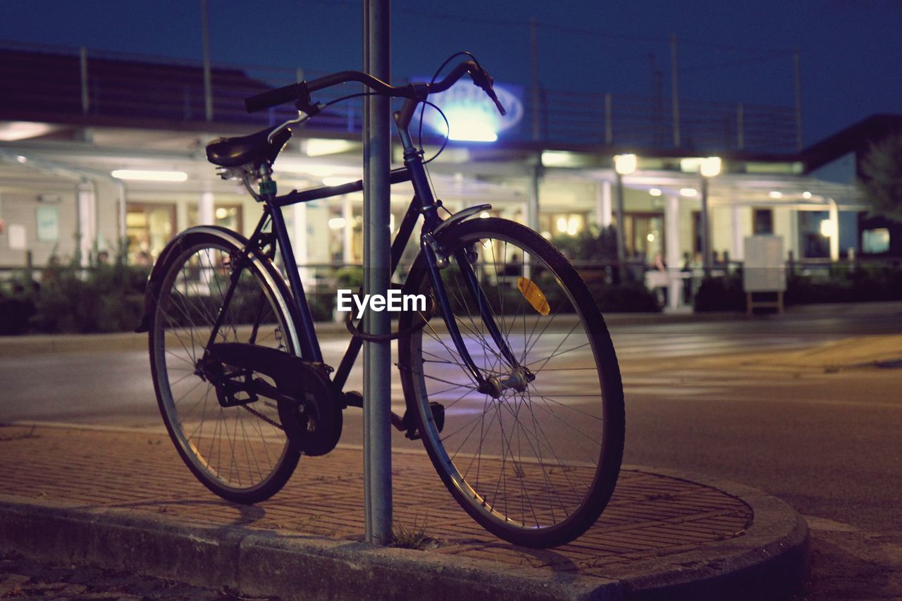 Bicycles on street at night