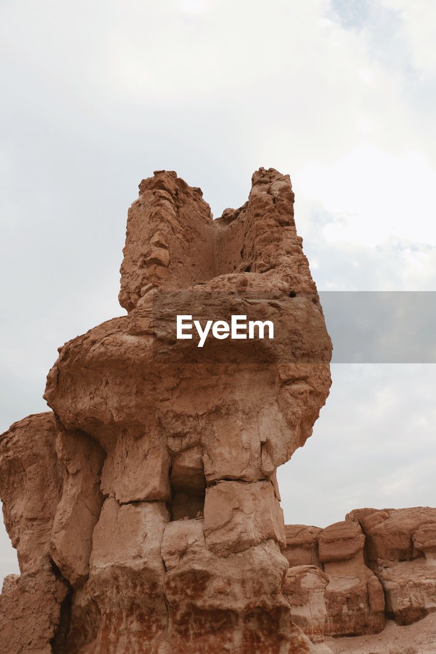 LOW ANGLE VIEW OF ROCK FORMATION
