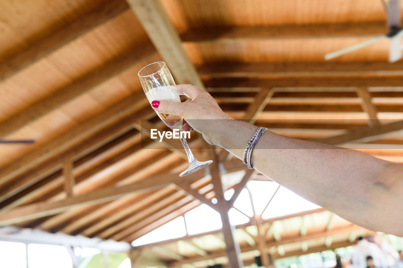 cropped hand of woman exercising in building