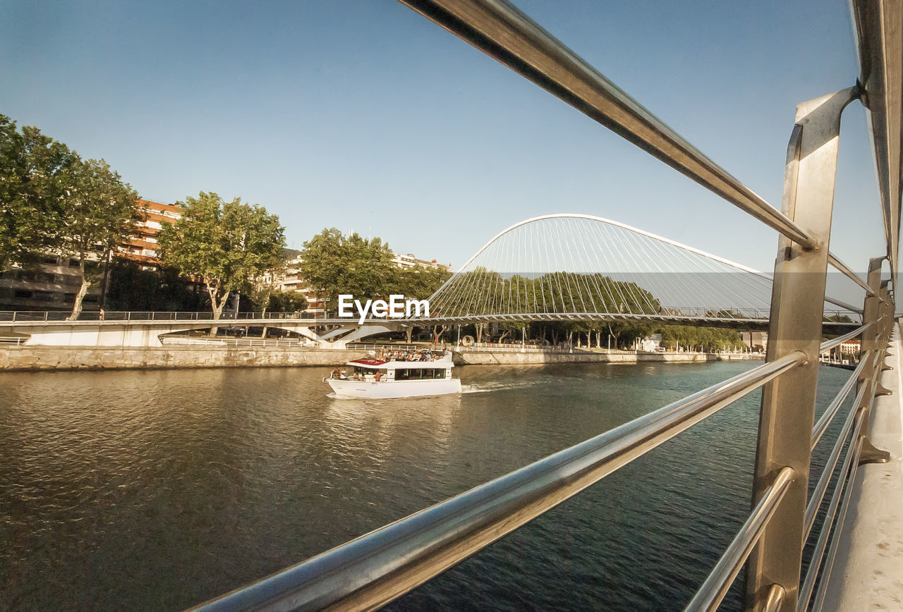 VIEW OF BRIDGE OVER RIVER AGAINST SKY