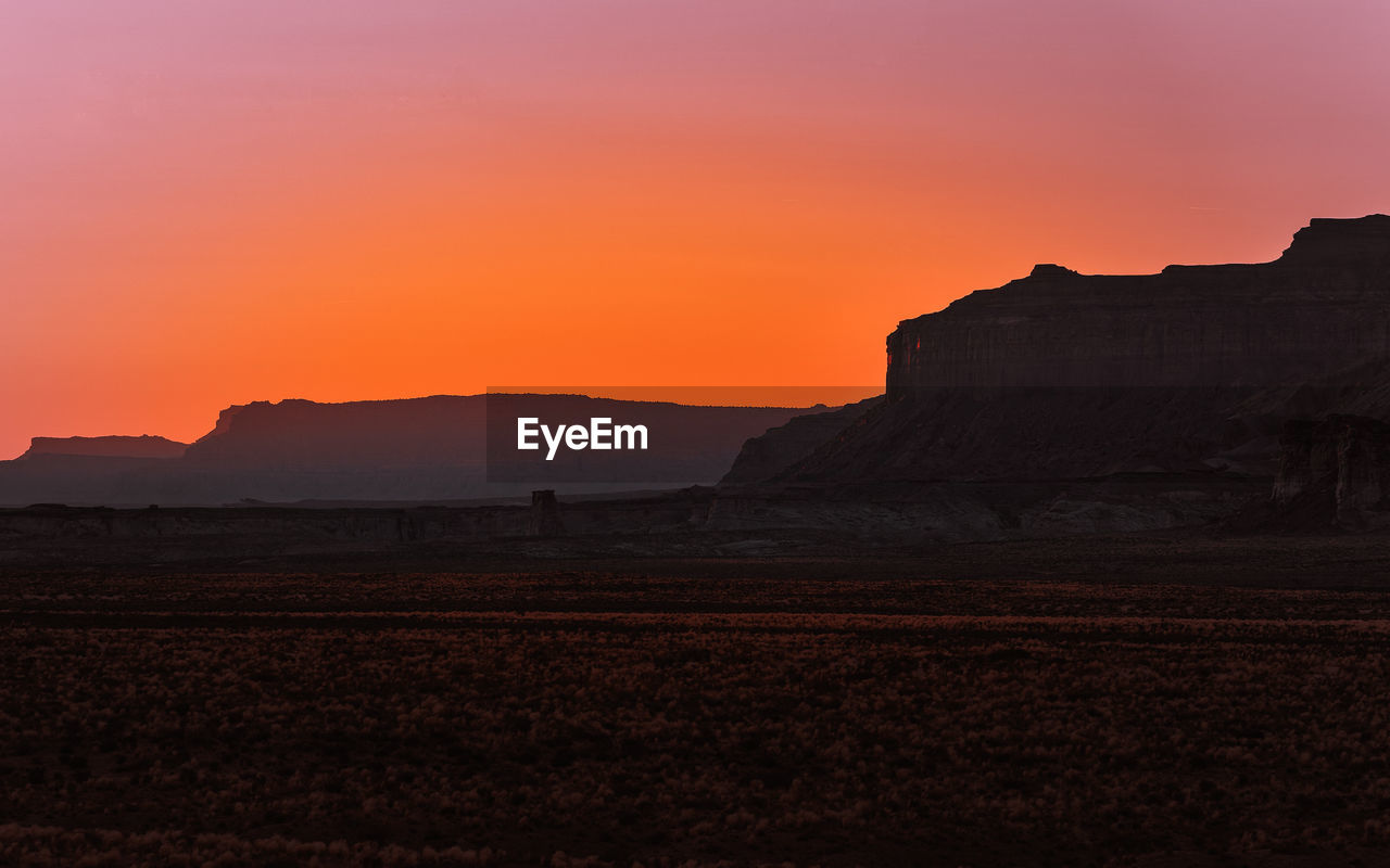 SCENIC VIEW OF SILHOUETTE LANDSCAPE DURING SUNSET