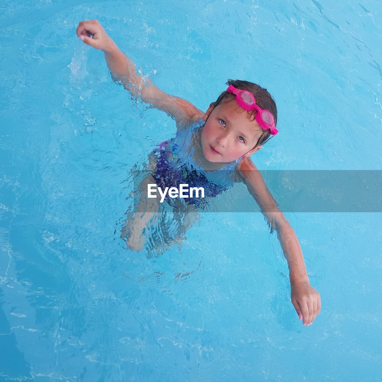 Portrait of girl swimming in pool