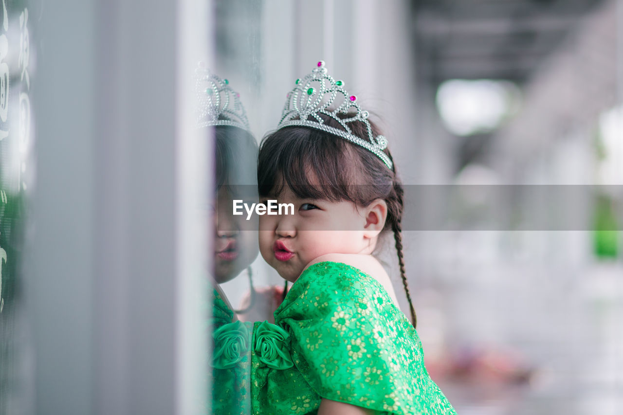 Portrait of cute girl wearing crown