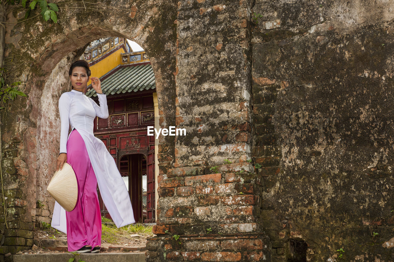 Beautiful woman exploring the imperial palace in hue / vietnam