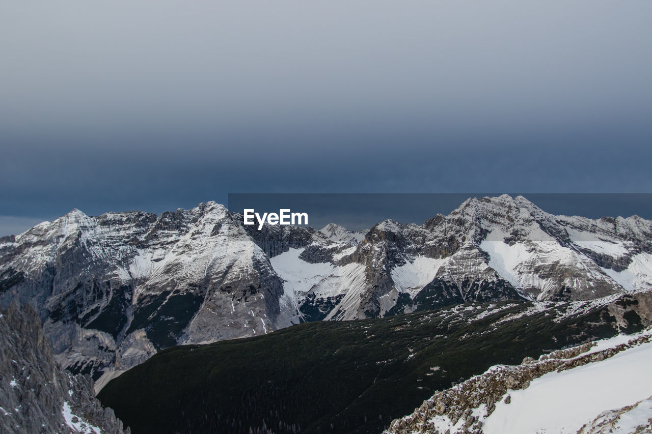 Scenic view of snowcapped mountains against sky