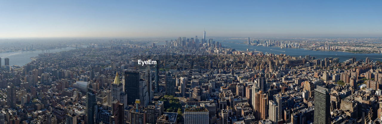 High angle view of modern buildings in city against sky