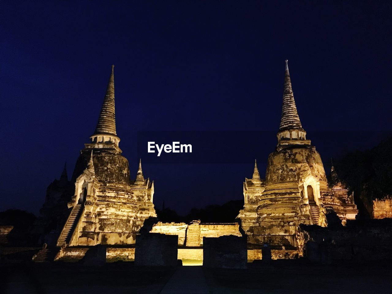 Low angle view of historic temple against sky at night