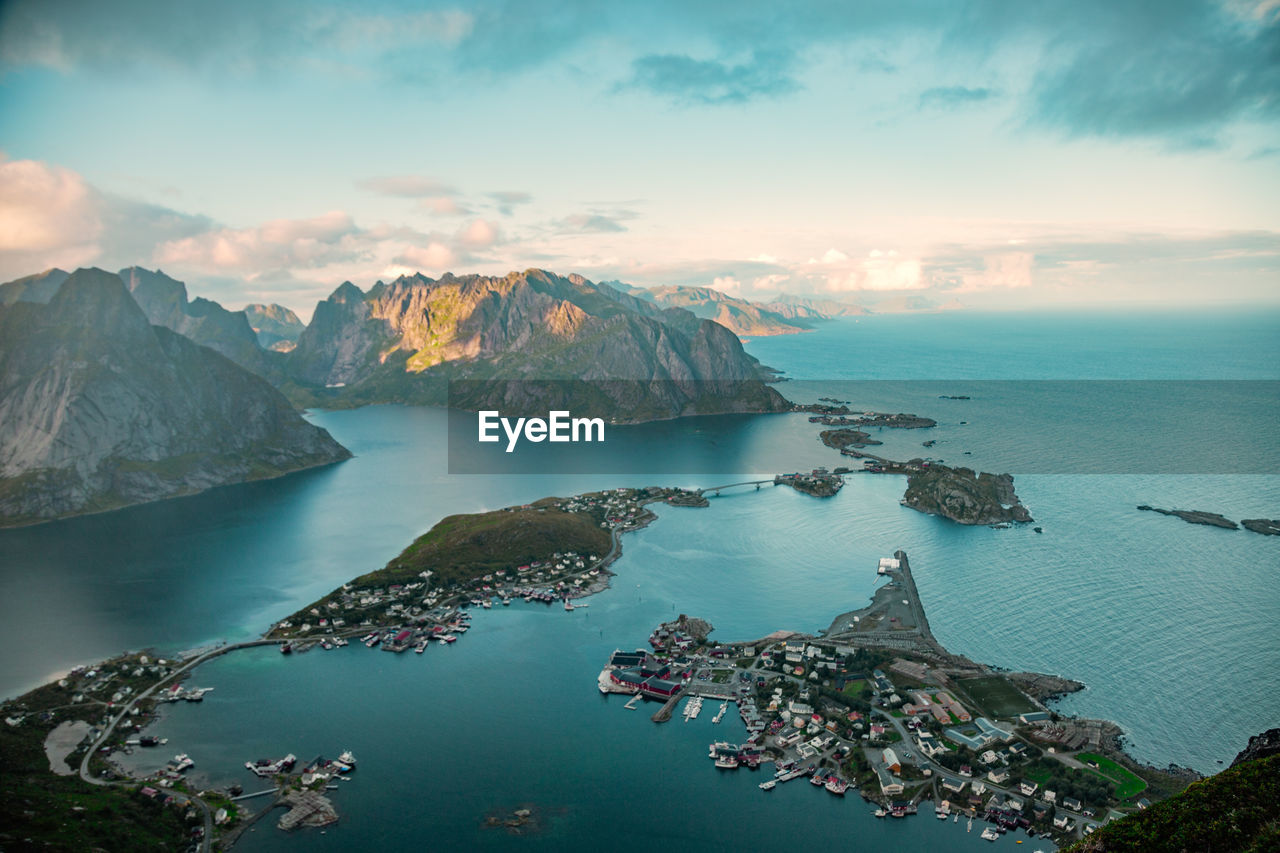 Scenic view of mountains and sea against sky during sunset, lofoten, norway