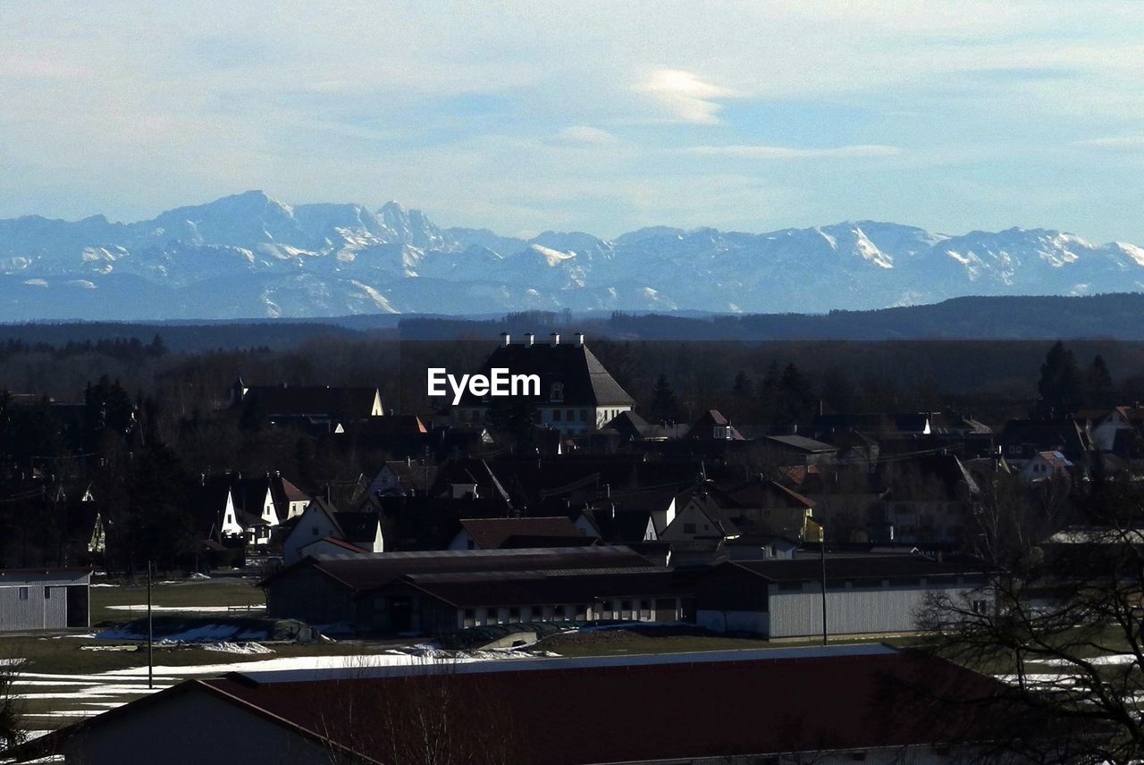 Town and mountains against sky at turkheim