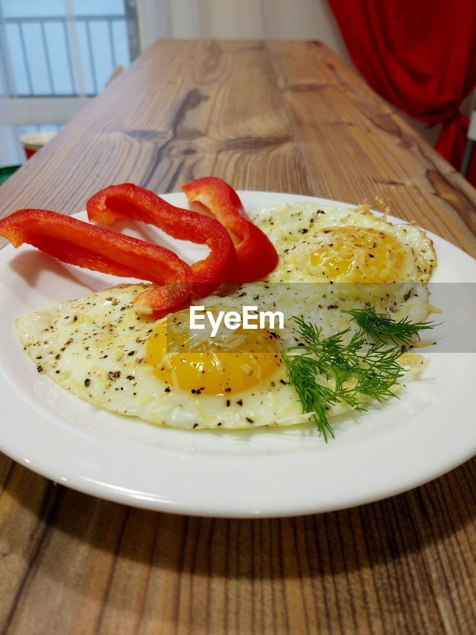 Two eggs breakfast with sliced paprika
