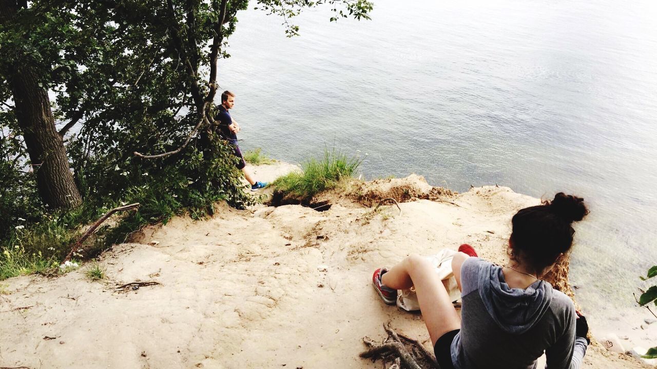 HIGH ANGLE VIEW OF DOG STANDING ON LAKE