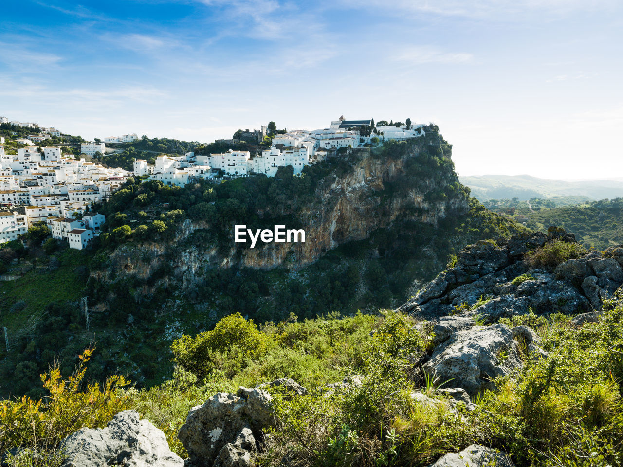 White village of casares tucked up into the mountains, malaga, s