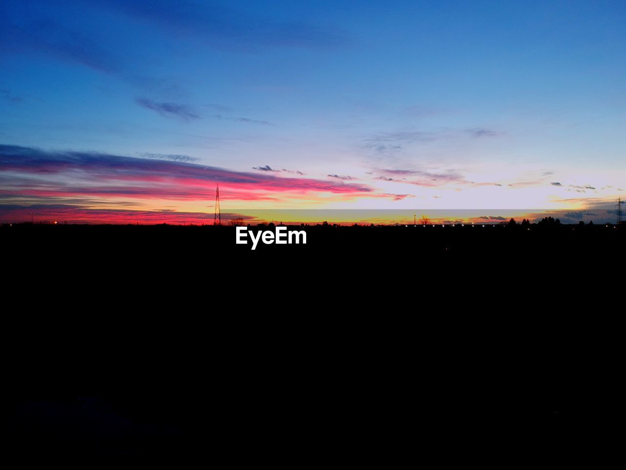 SILHOUETTE FIELD AGAINST SKY DURING SUNSET