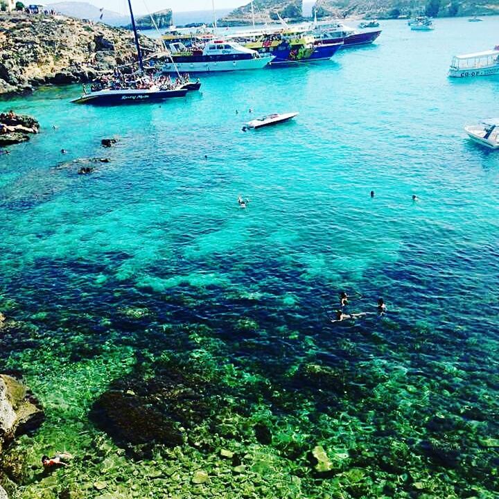 VIEW OF BOATS IN SEA