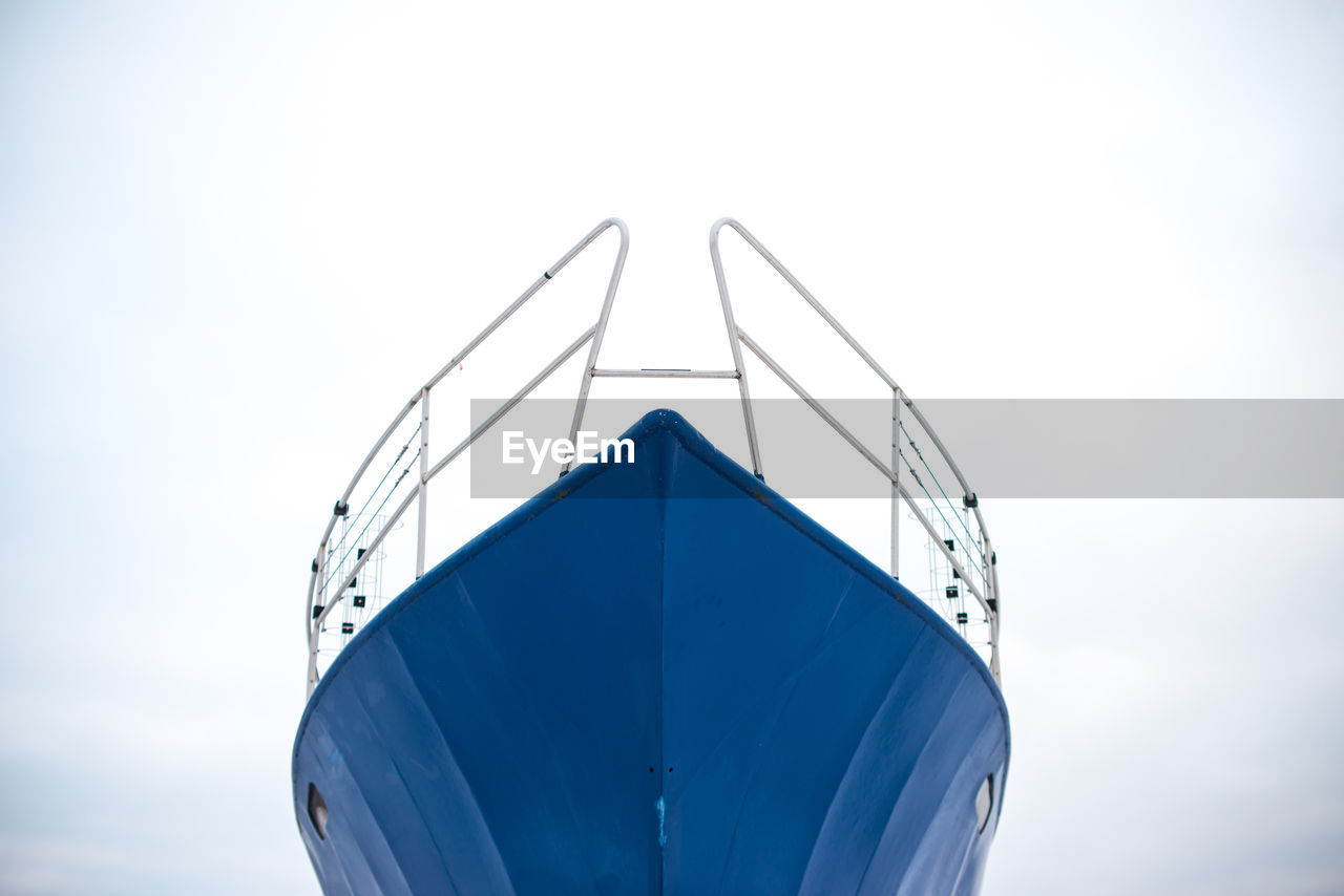 Low angle view of ship's bow against clear sky