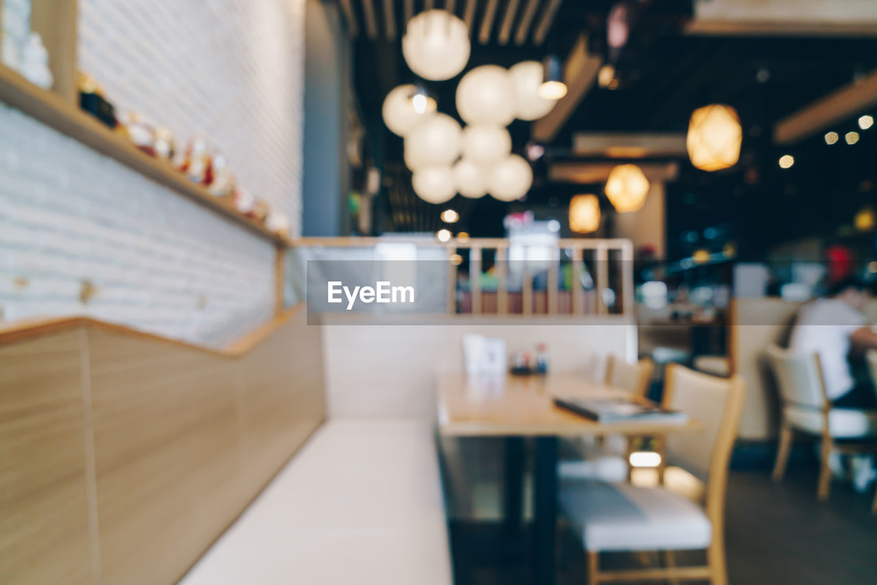 CLOSE-UP OF EMPTY CHAIRS IN RESTAURANT