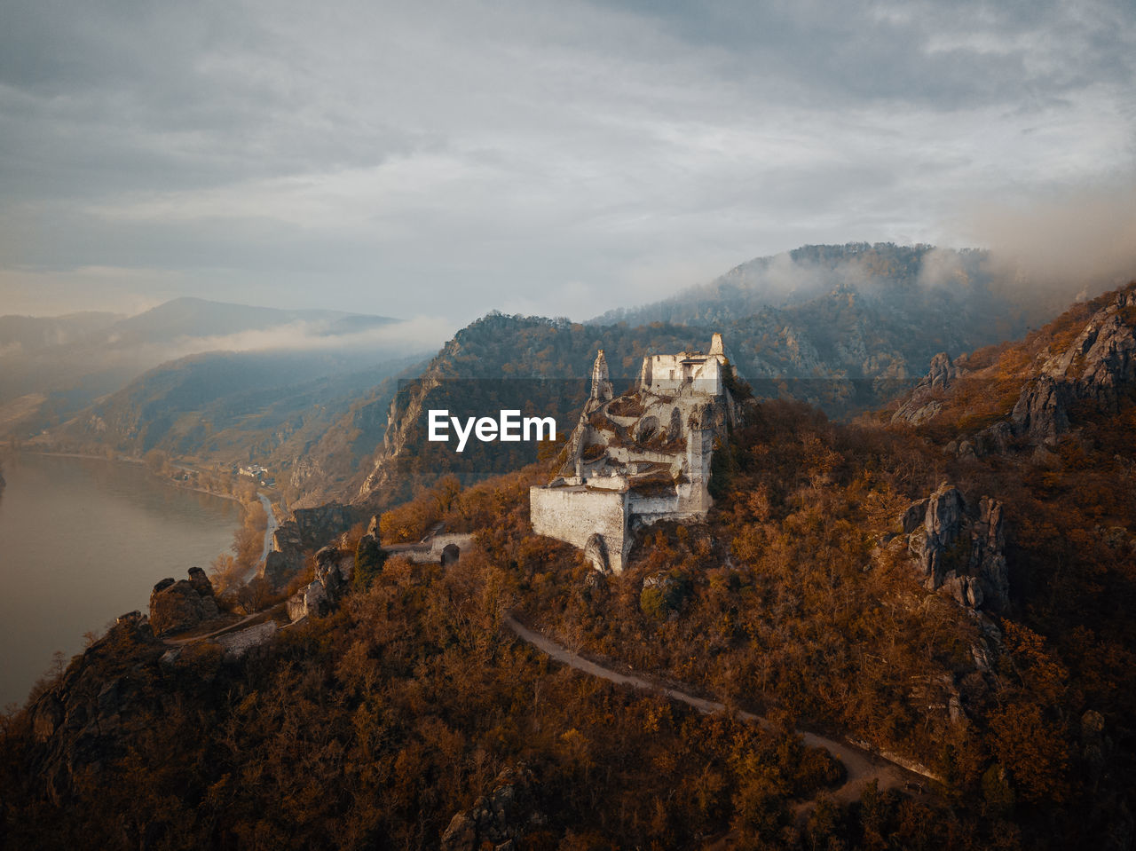 High angle view of mountain range against cloudy sky