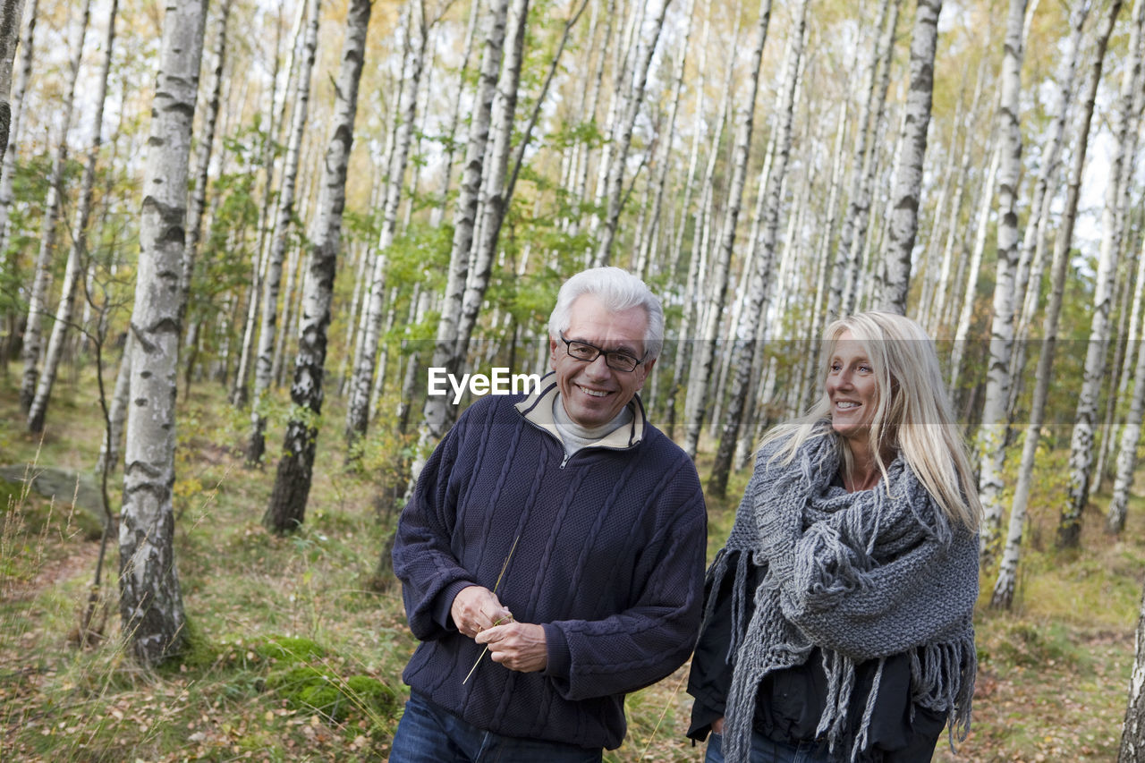 Senior couple walking in forest, delsjon, gothenburg, sweden
