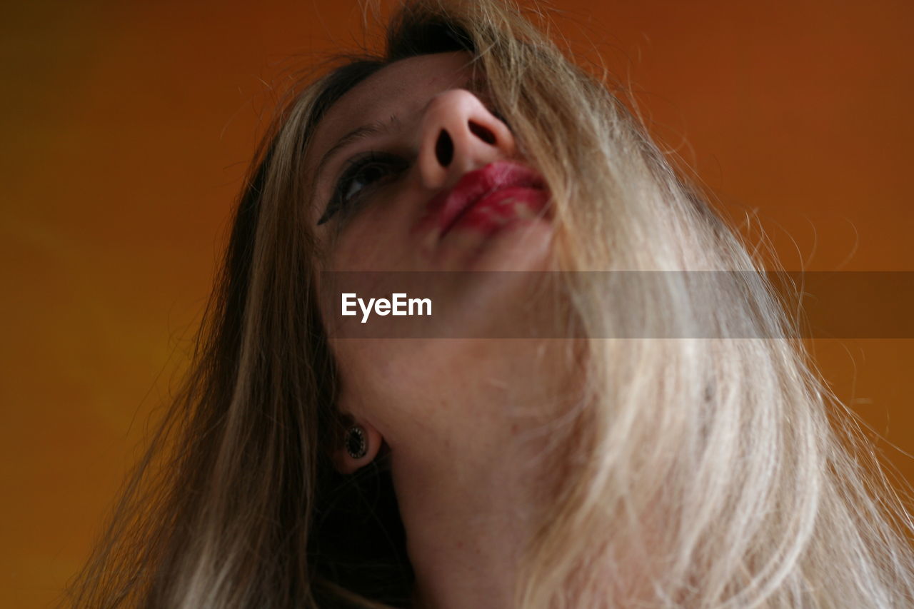 Close-up of thoughtful woman with smudged make-up