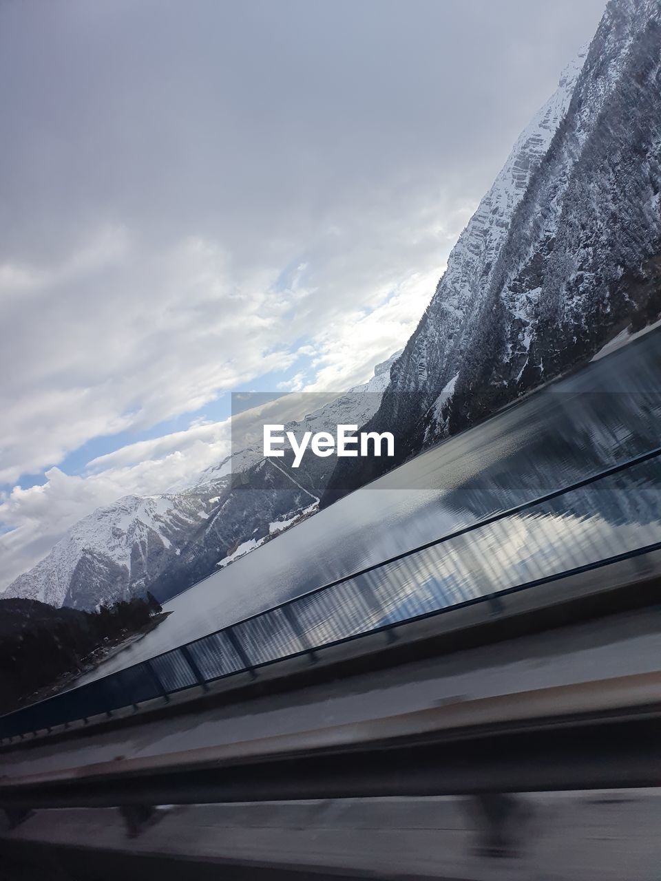 AERIAL VIEW OF SNOWCAPPED MOUNTAIN AGAINST SKY