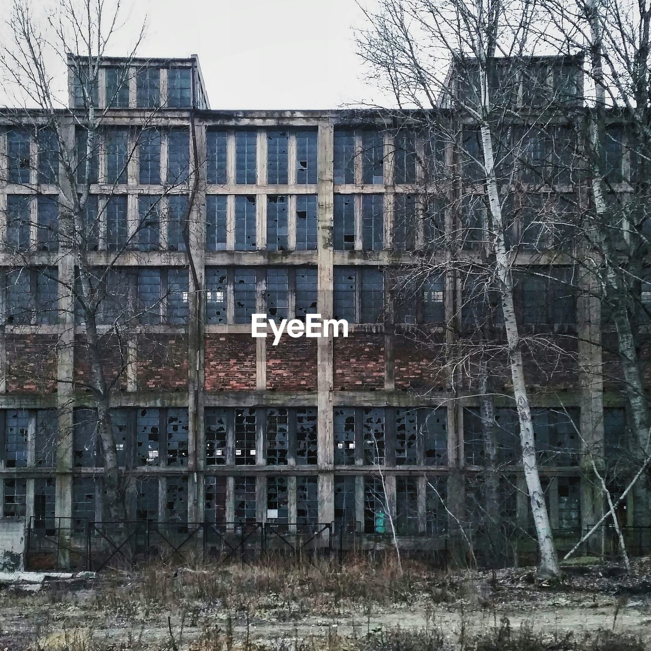 Exterior of abandoned building against clear sky