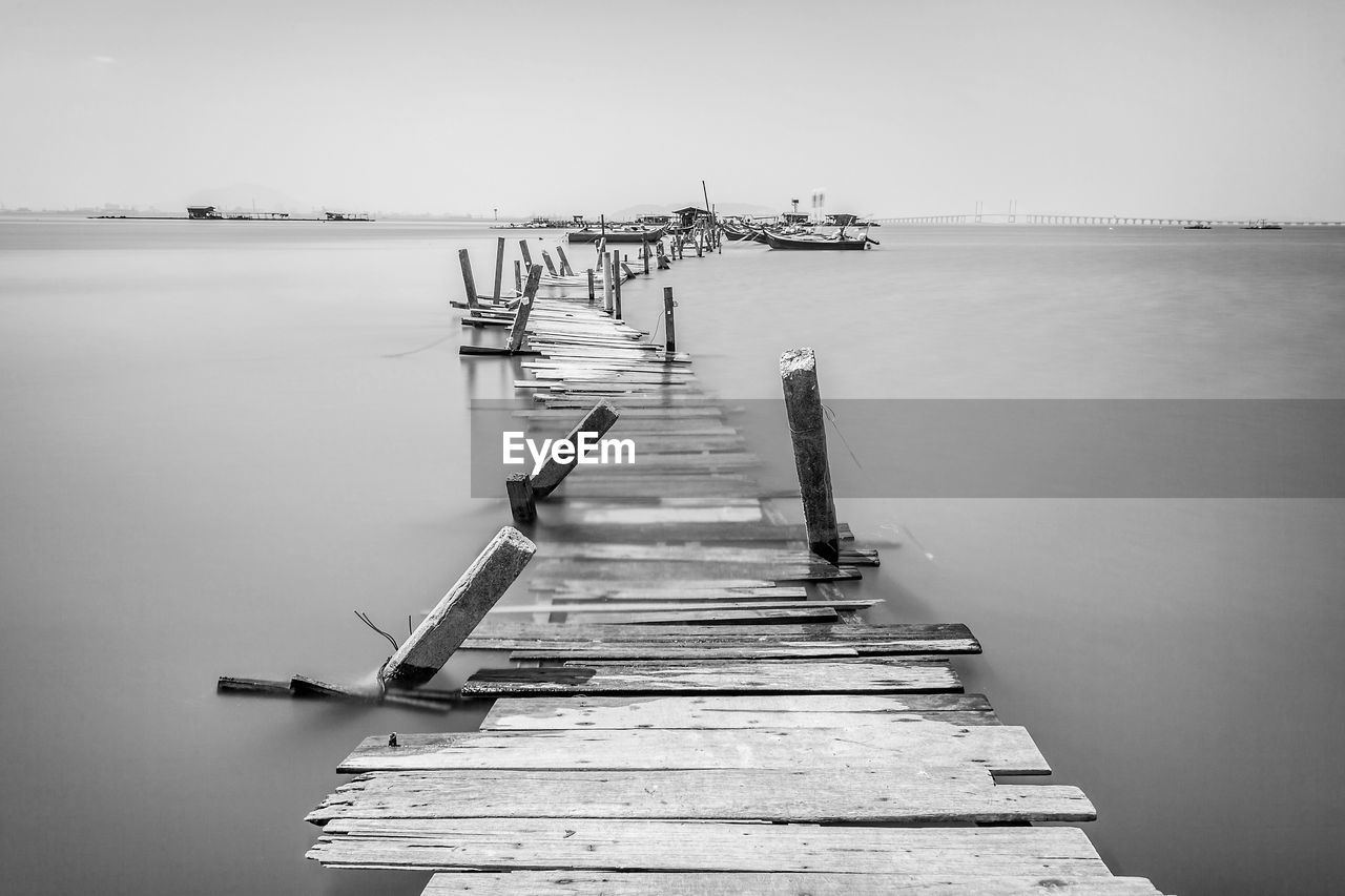 PIER OVER SEA AGAINST CLEAR SKY