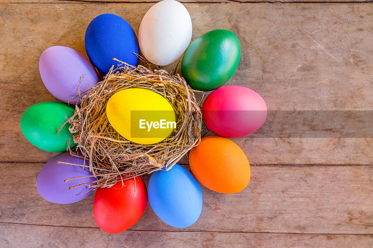 Directly above shot of multi colored easter eggs on table