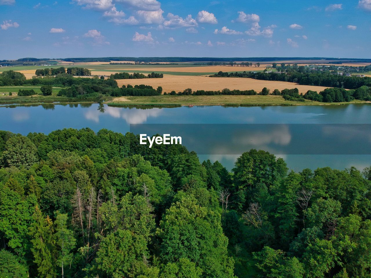 SCENIC VIEW OF TREES AND LAKE AGAINST SKY