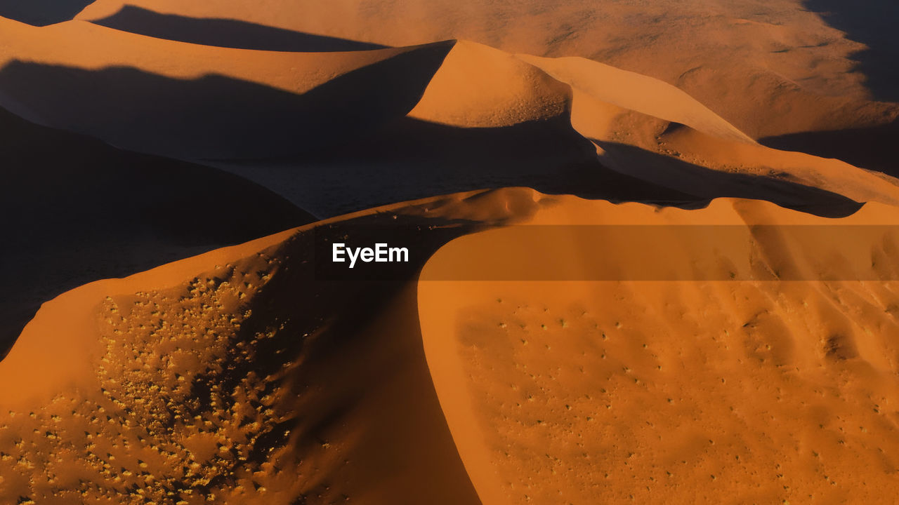 CLOSE-UP OF SAND DUNE IN DESERT