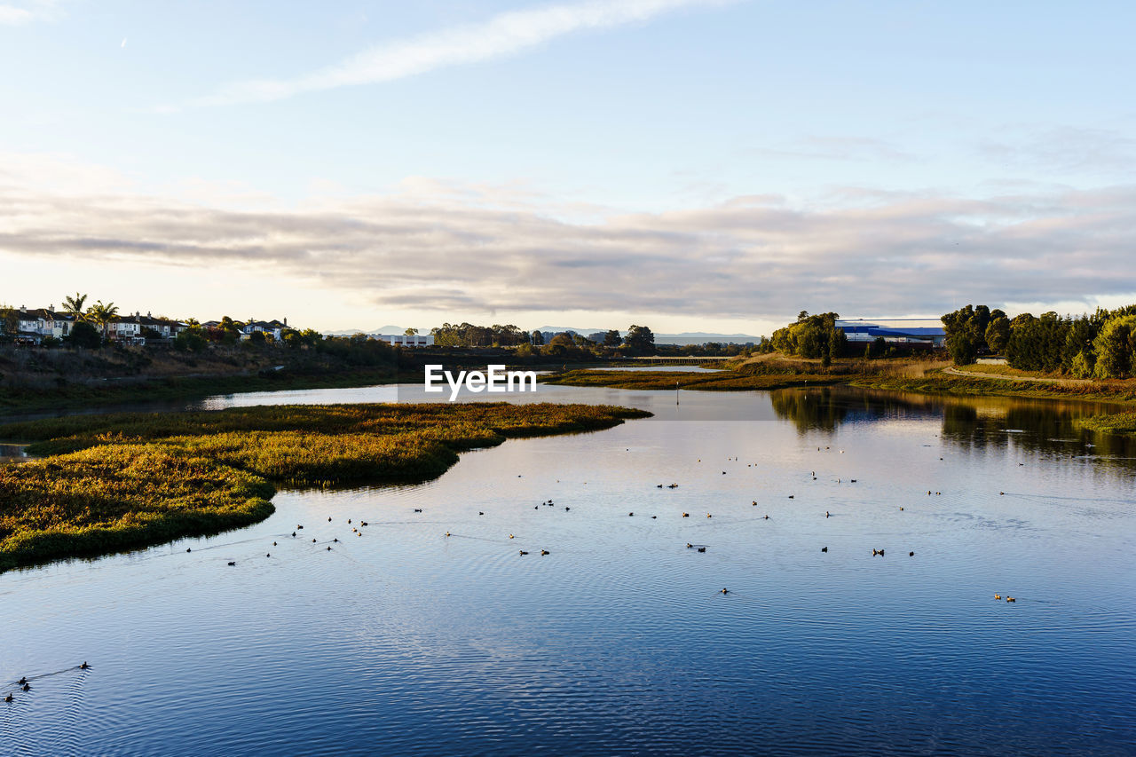 SCENIC VIEW OF LAKE WITH REFLECTION AGAINST SKY