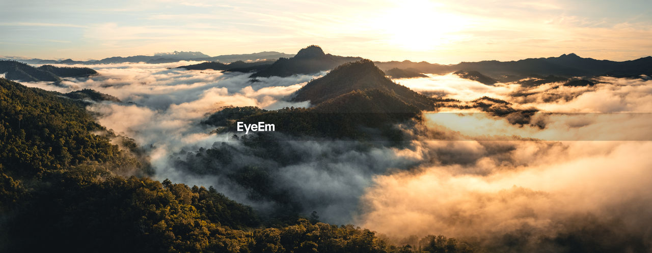 SCENIC VIEW OF MOUNTAIN RANGE AGAINST SKY DURING SUNSET