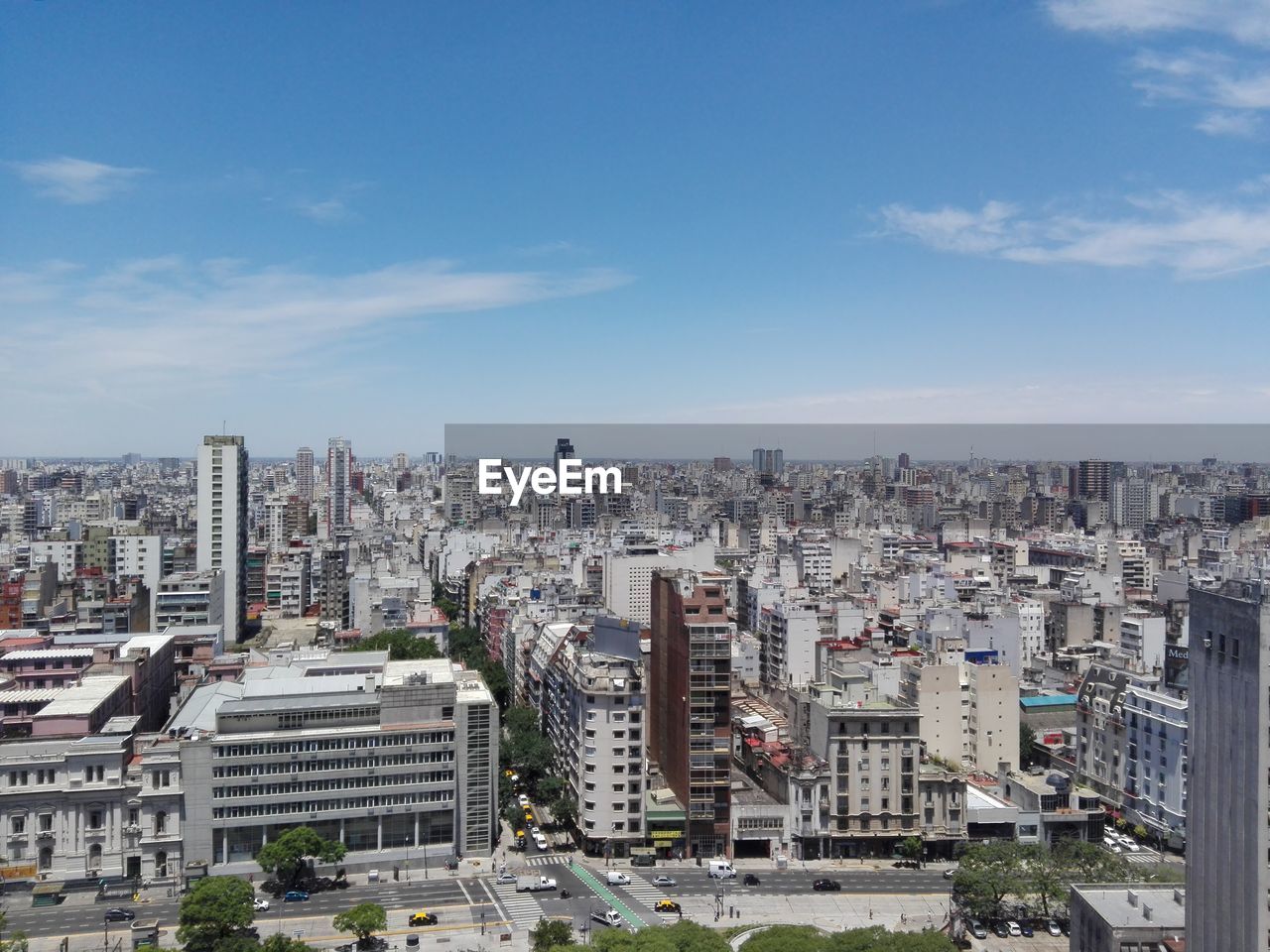 High angle view of buildings in city against sky