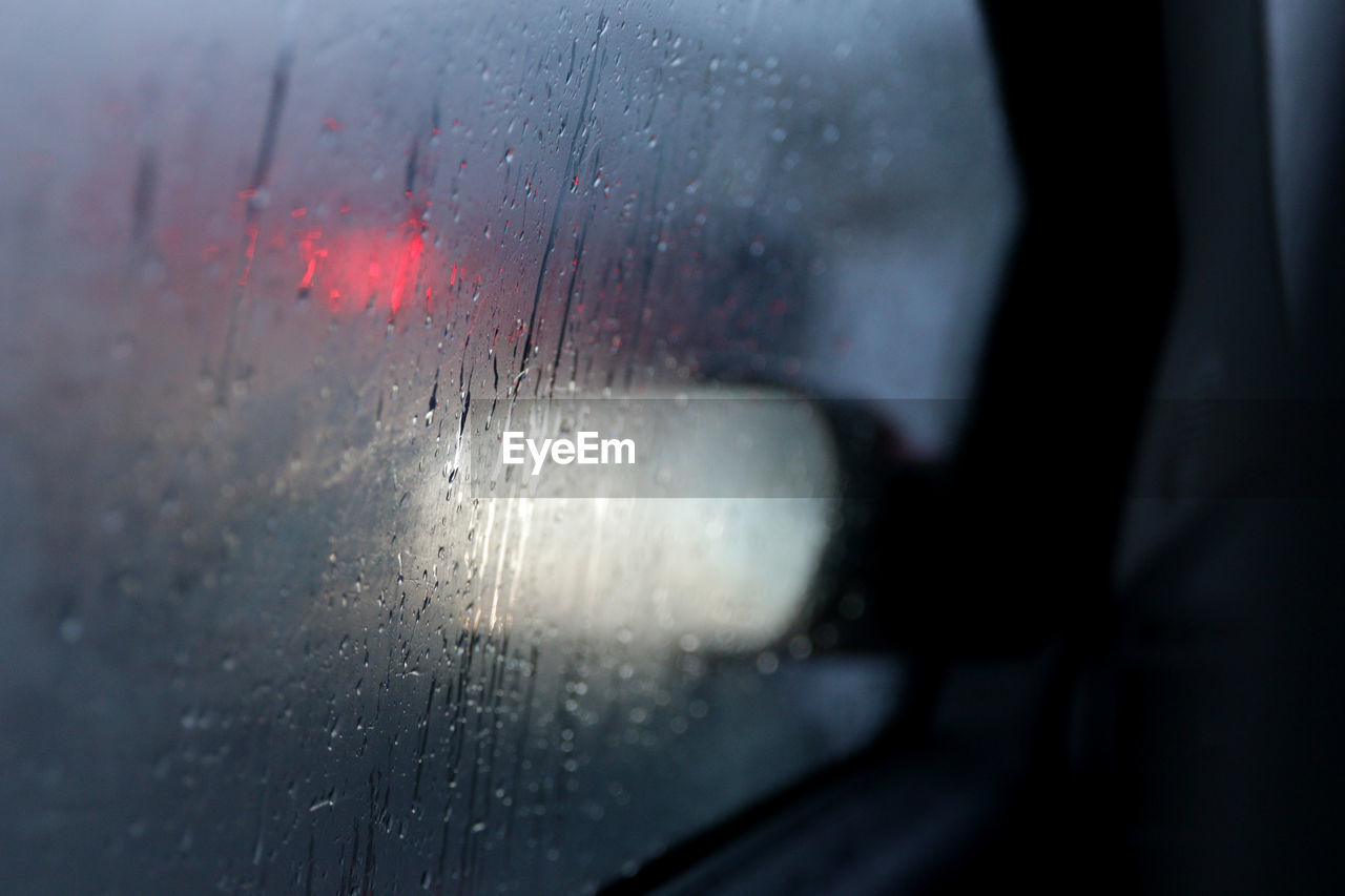 Close-up of wet car window