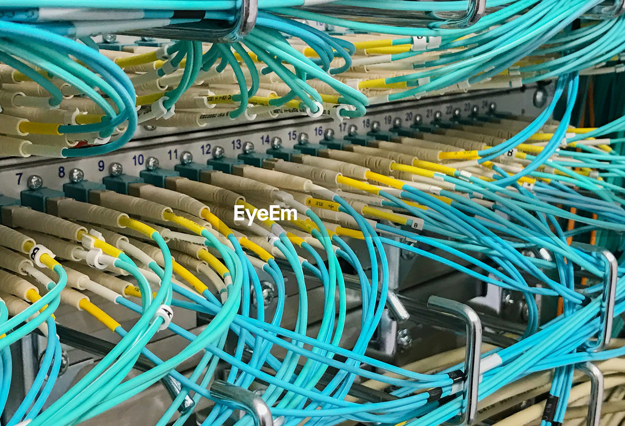 Network cable on a network hub and fiber optic light waveguide on a switch