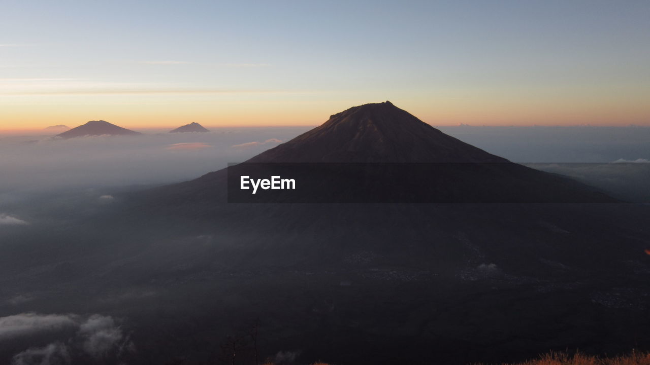 Scenic view of mountains against sky during sunset