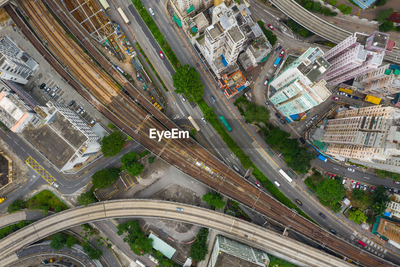 HIGH ANGLE VIEW OF CITY STREET AMIDST BUILDINGS