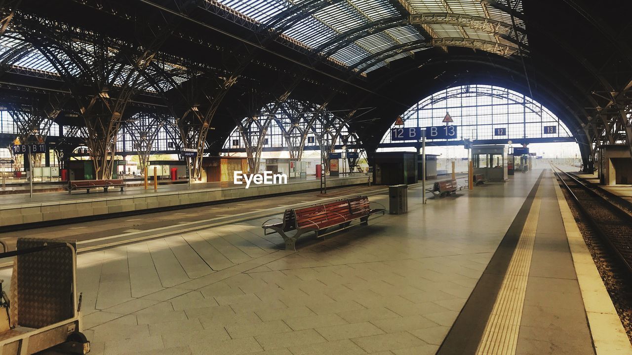 TRAIN ON RAILROAD STATION PLATFORM