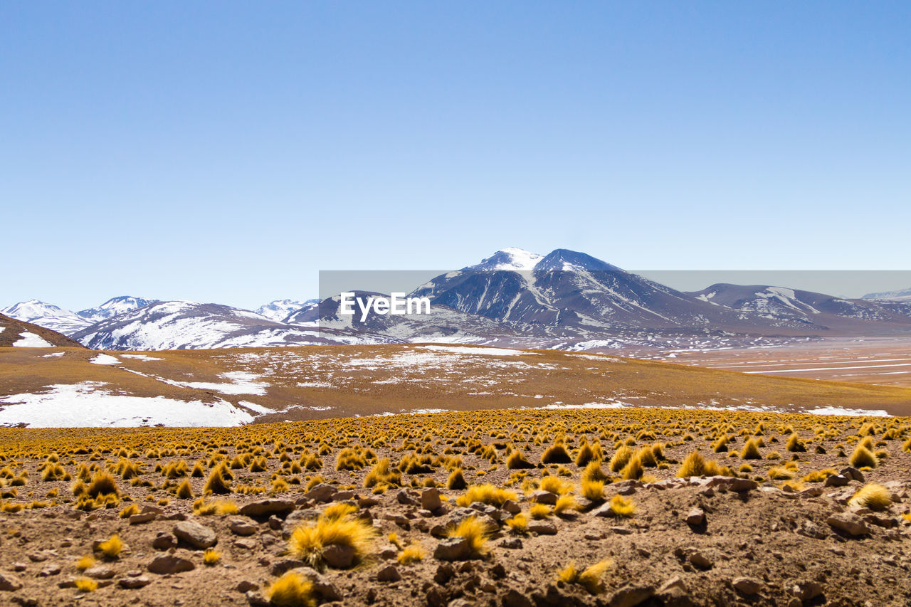 scenic view of mountains against clear blue sky