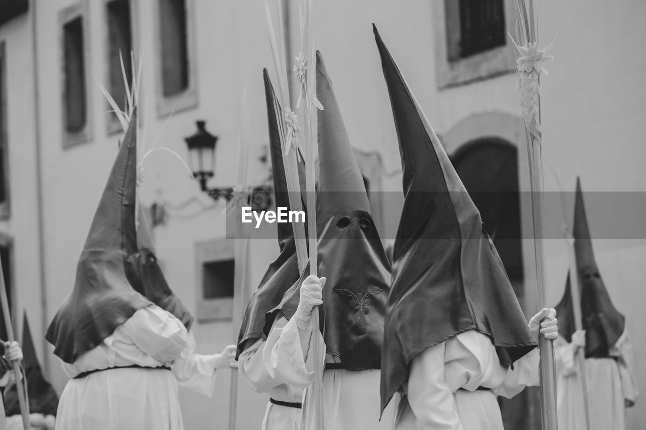 Hooded people in a procession, holy week