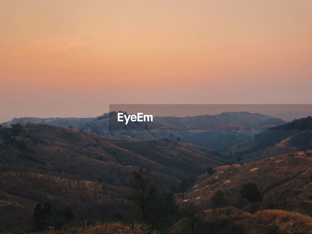 Scenic view of mountains against sky during sunset