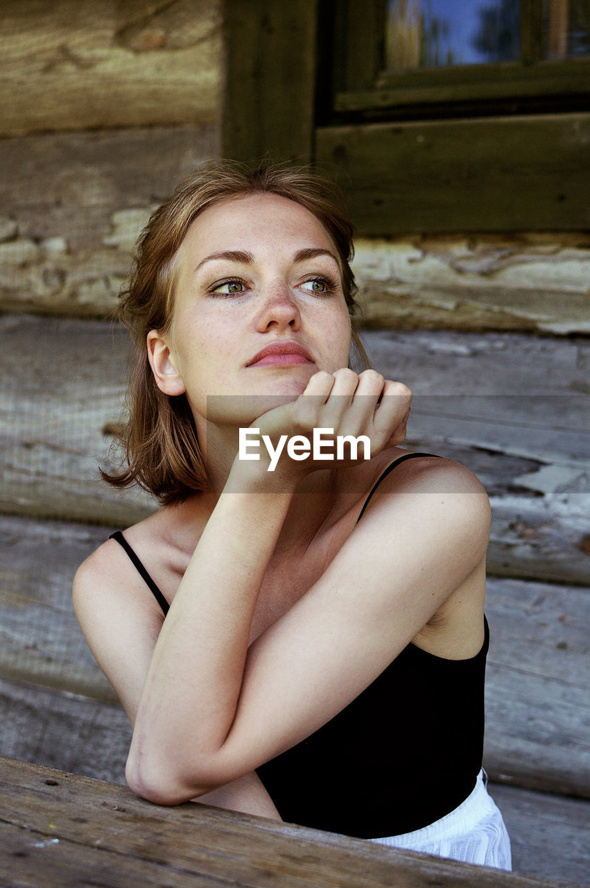 Close-up of thoughtful young woman looking away