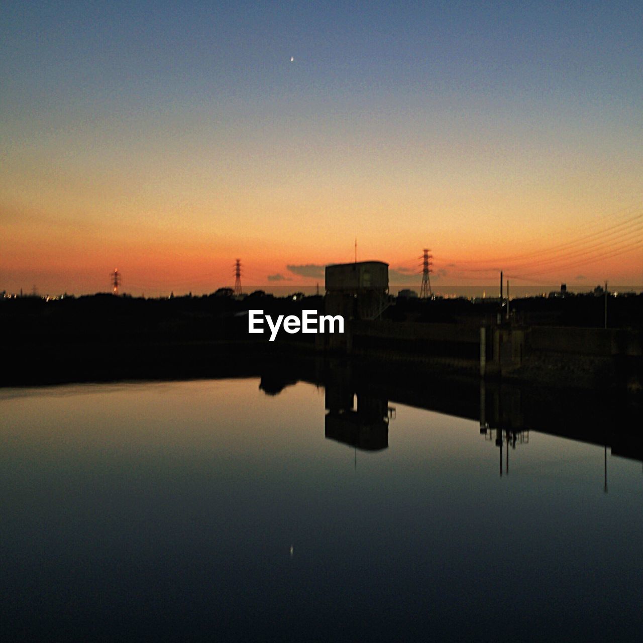 VIEW OF RIVER AT SUNSET