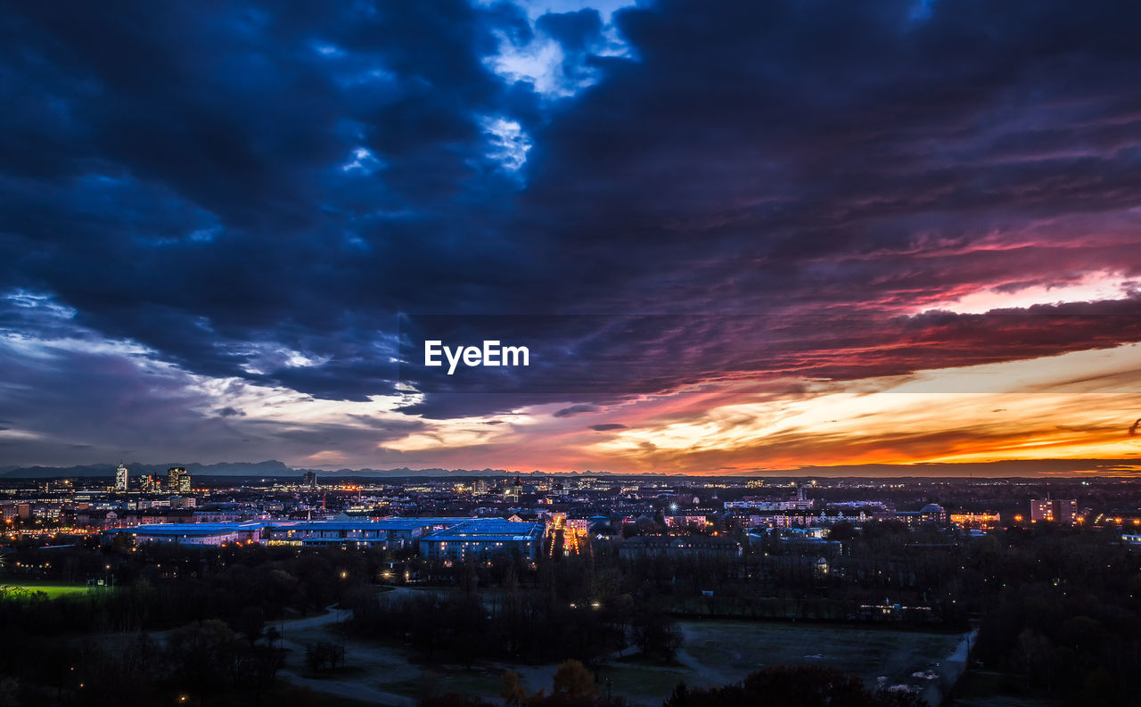 Aerial view of city lit up at night