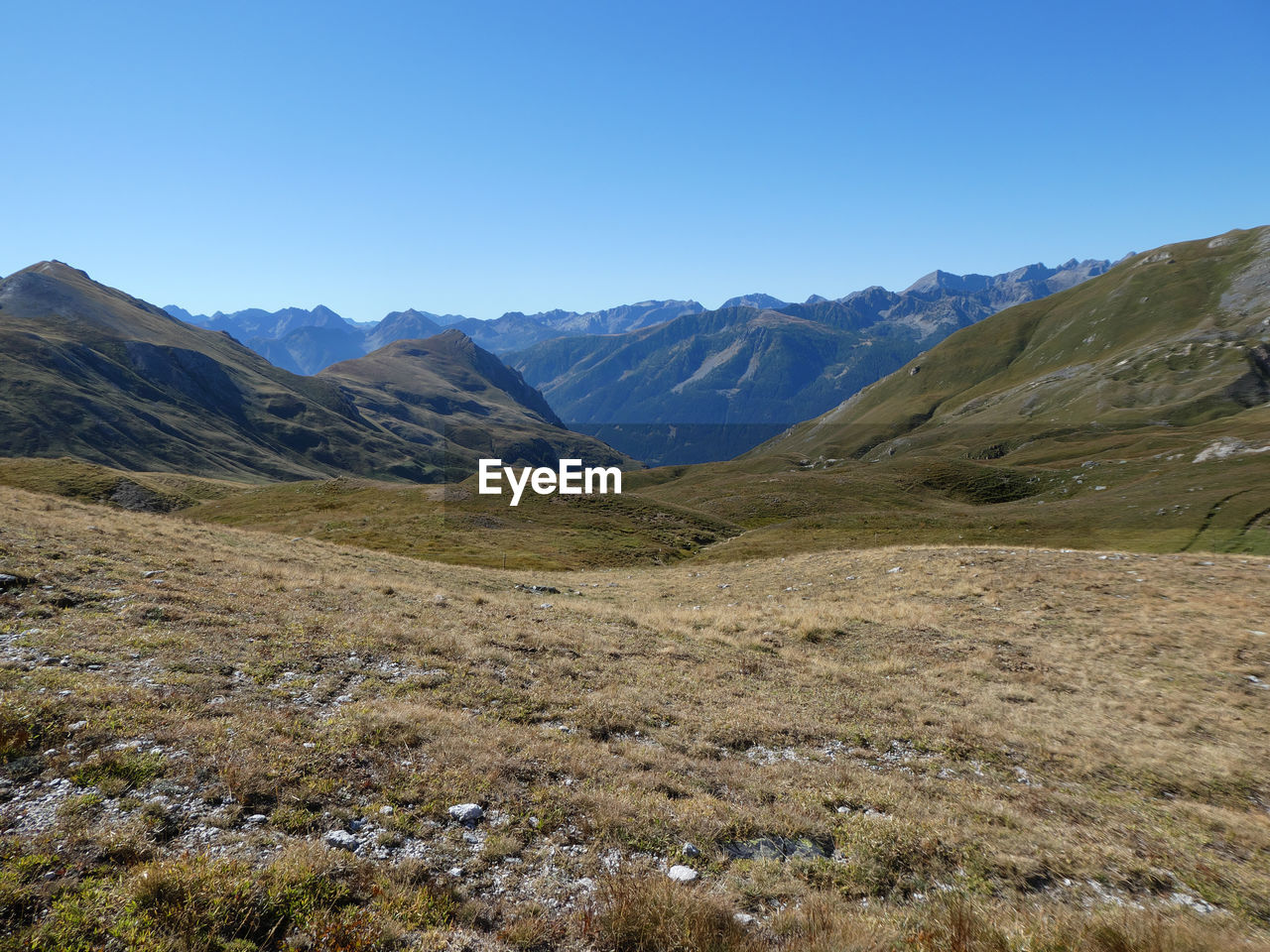 Panoramic alpine landscape against clear blue sky near colle del preit